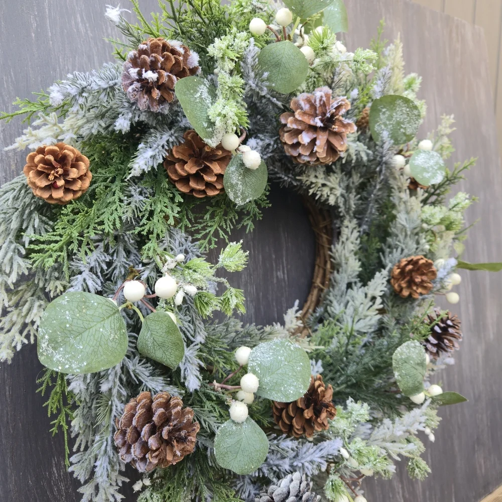 Handmade lush, artificial Winter Greenery Wreath With White And Brown Accents